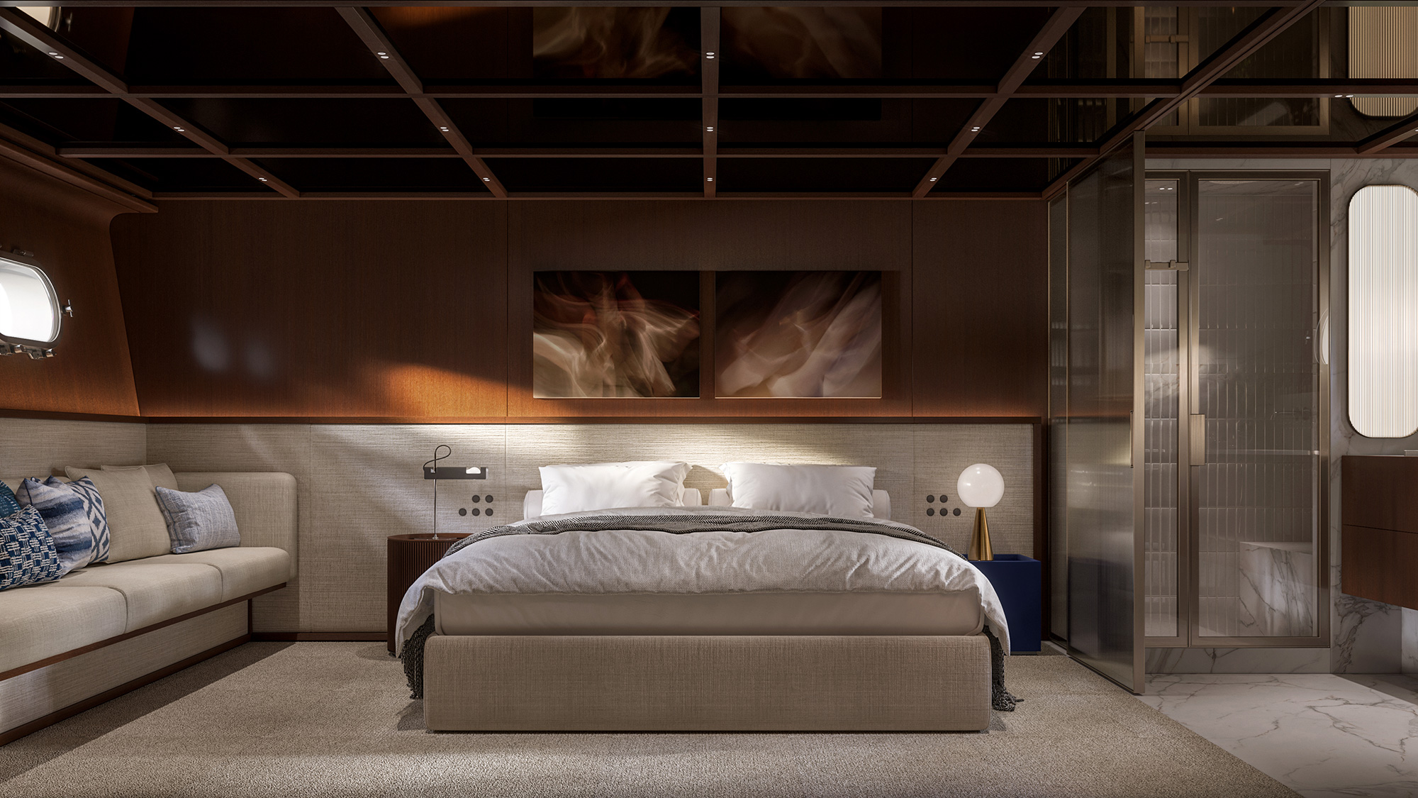 A cabin with a double berth, a sofa alongside and a glass partition aft