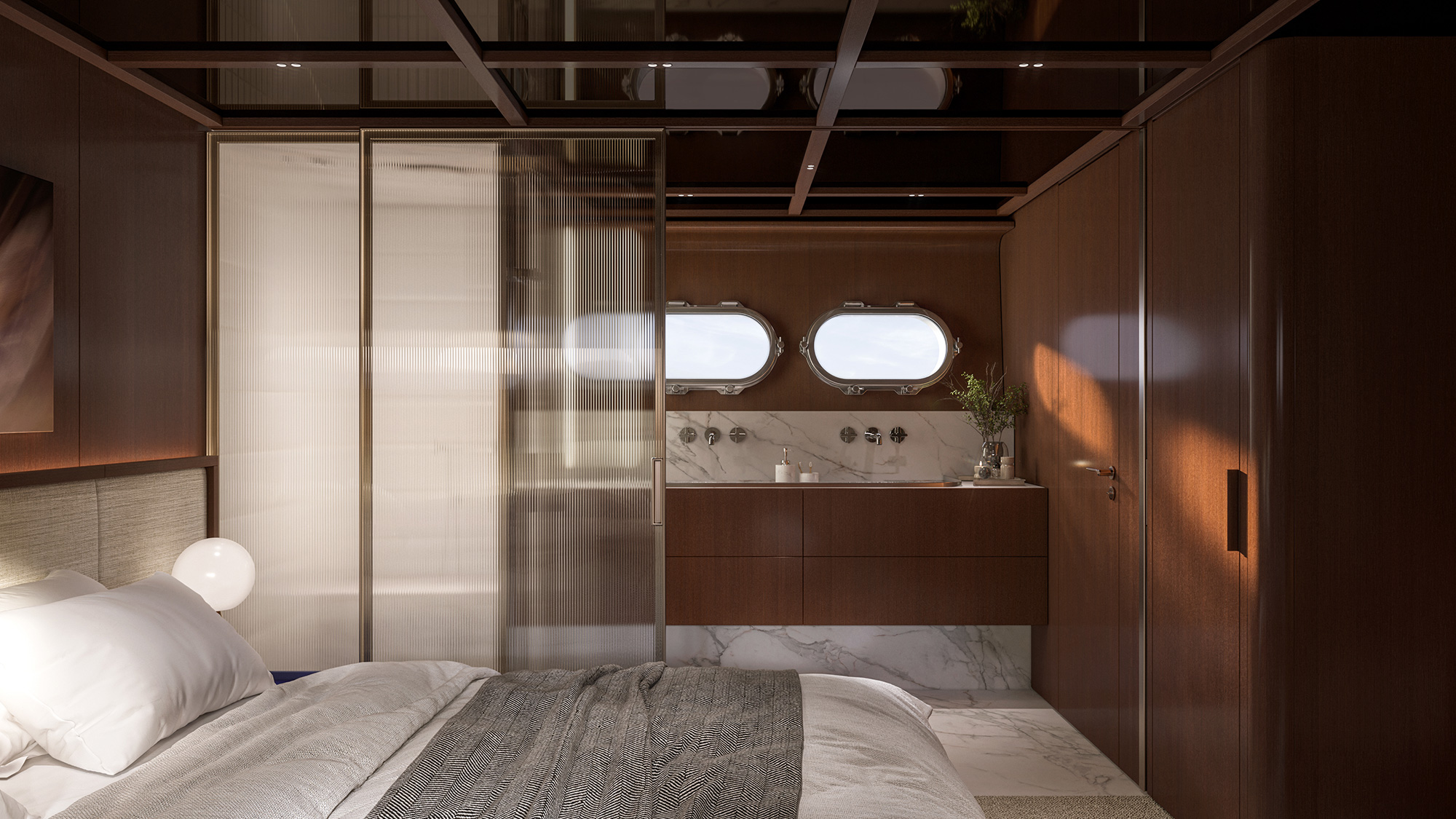 A cabin with twin portlights above a washbasin counter