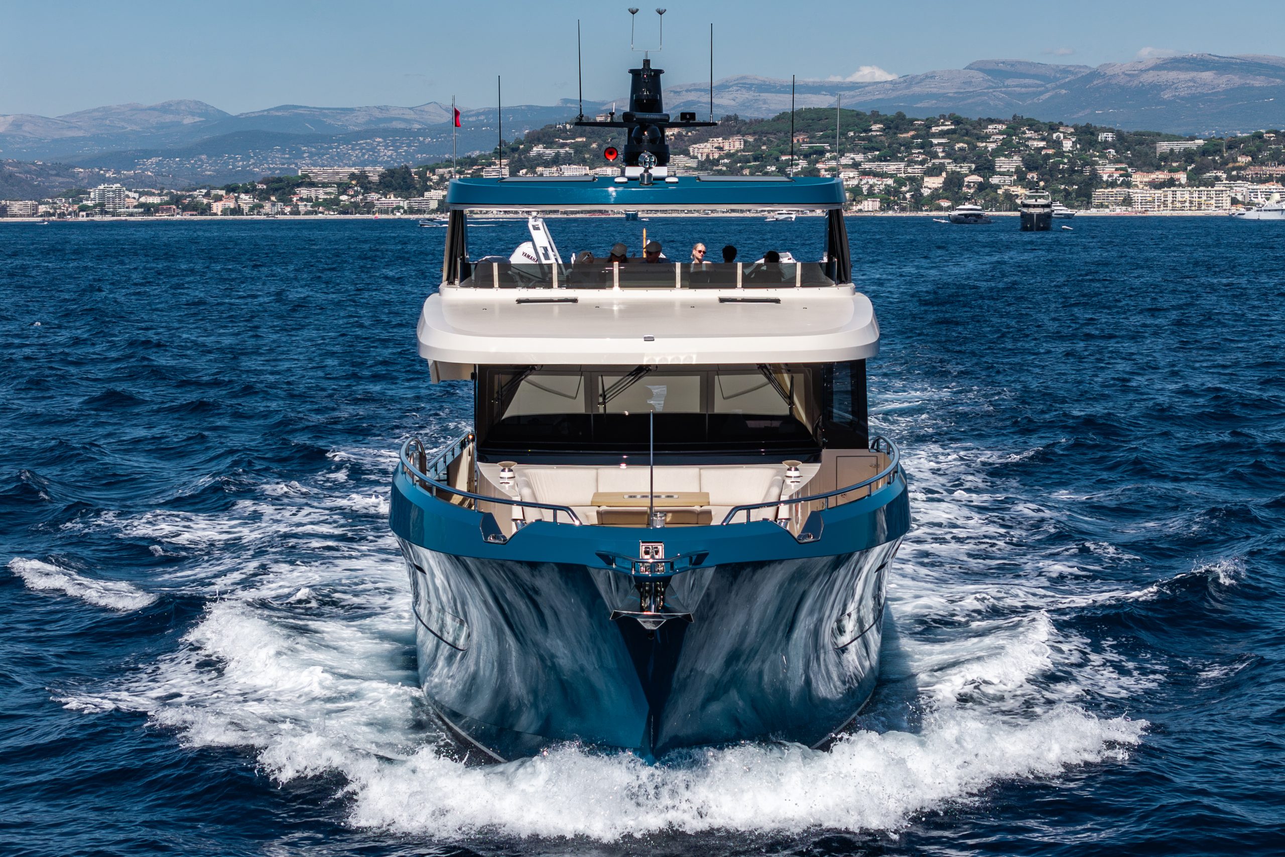 The 67 head-on at speed, pushing a bow wave