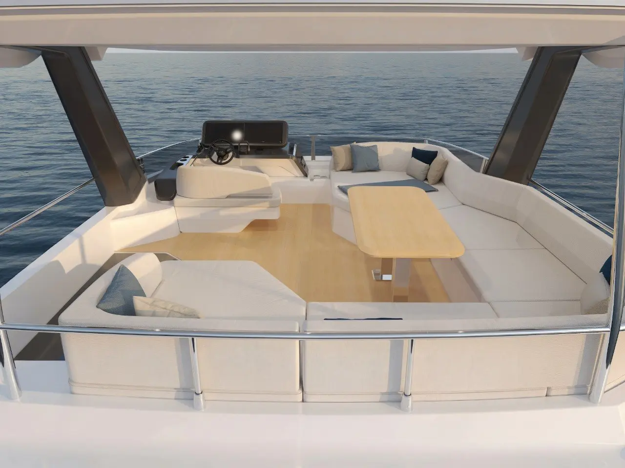 The flybridge under its hardtop, with a dining table and helm forward