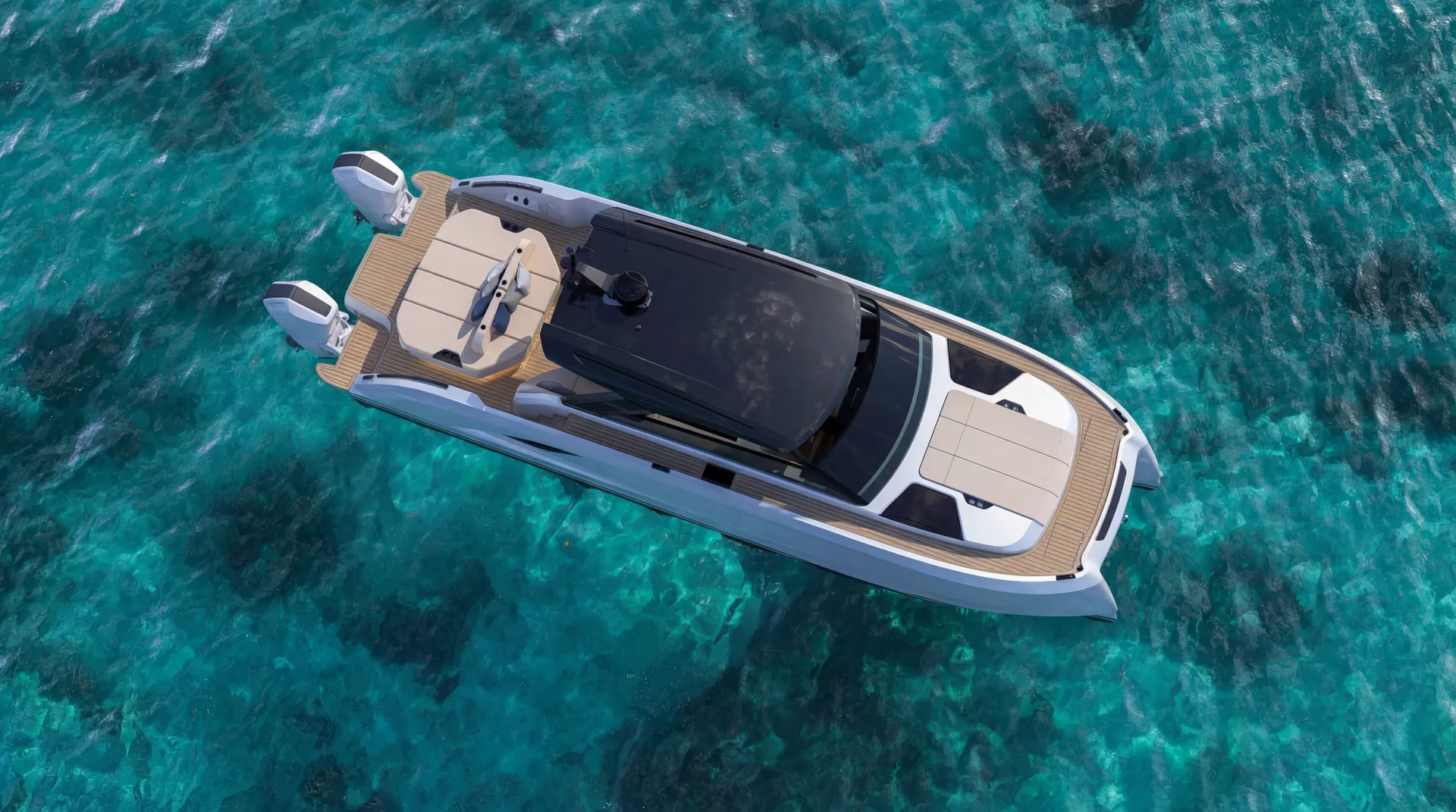 The VYBE 43 seen from directly overhead at anchor over pale turquoise water, her teak decks, sunpads and dark hardtop laid out between the two hulls, twin outboards on the transom