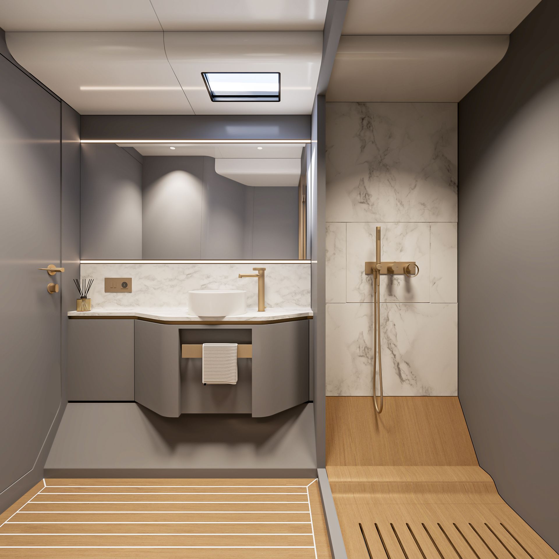 The heads, a round basin on a marble top with brushed brass fittings, a full-width mirror above and a separate shower area in marble to one side
