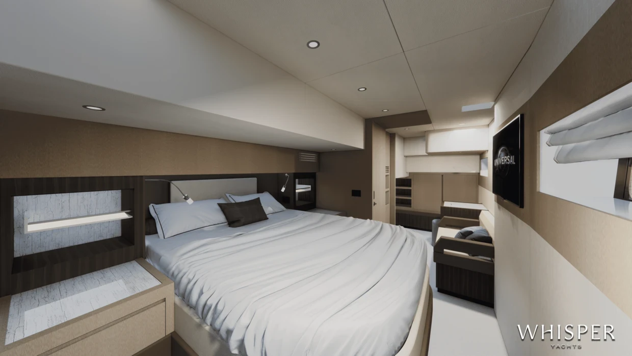 A cabin with a double berth between reading lights and a long hull window