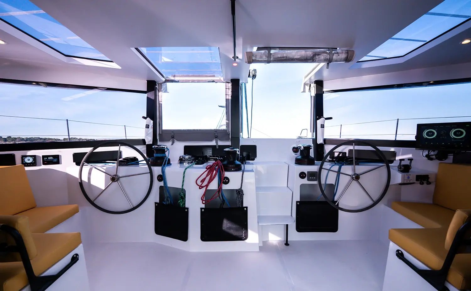 The twin helm stations under the hardtop, with a wheel each side