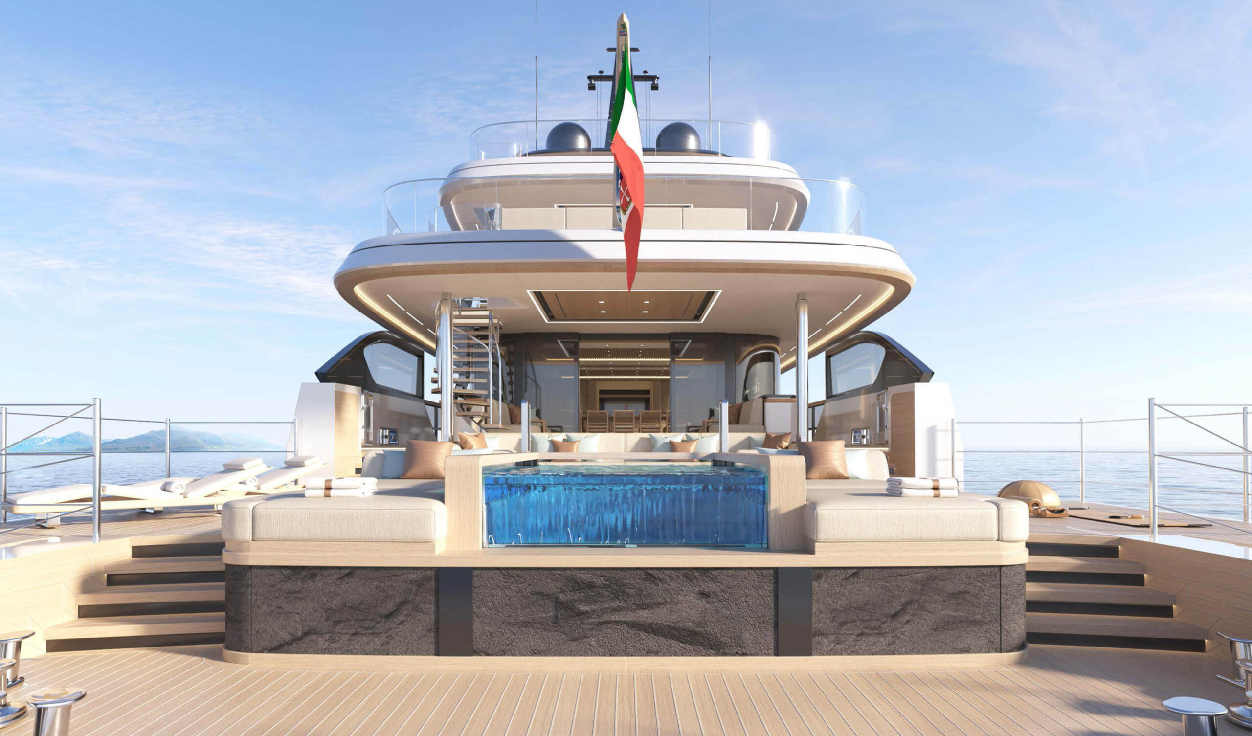 A rendering looking forward from the aft deck at a glass-sided pool set between two day beds, the saloon beyond