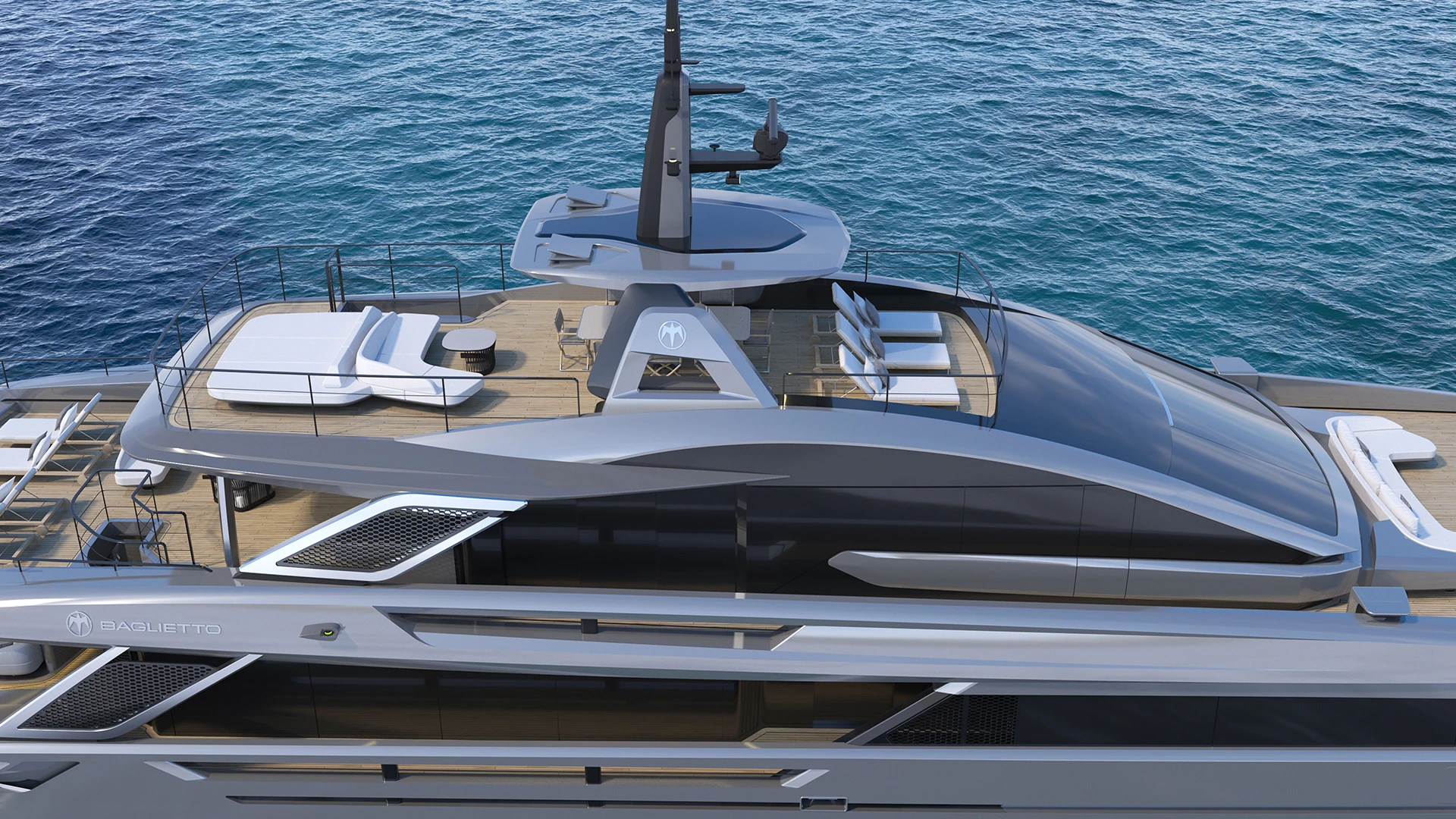 Looking down along the FAST50's upper deck, with sun loungers, a dining table and the mast above