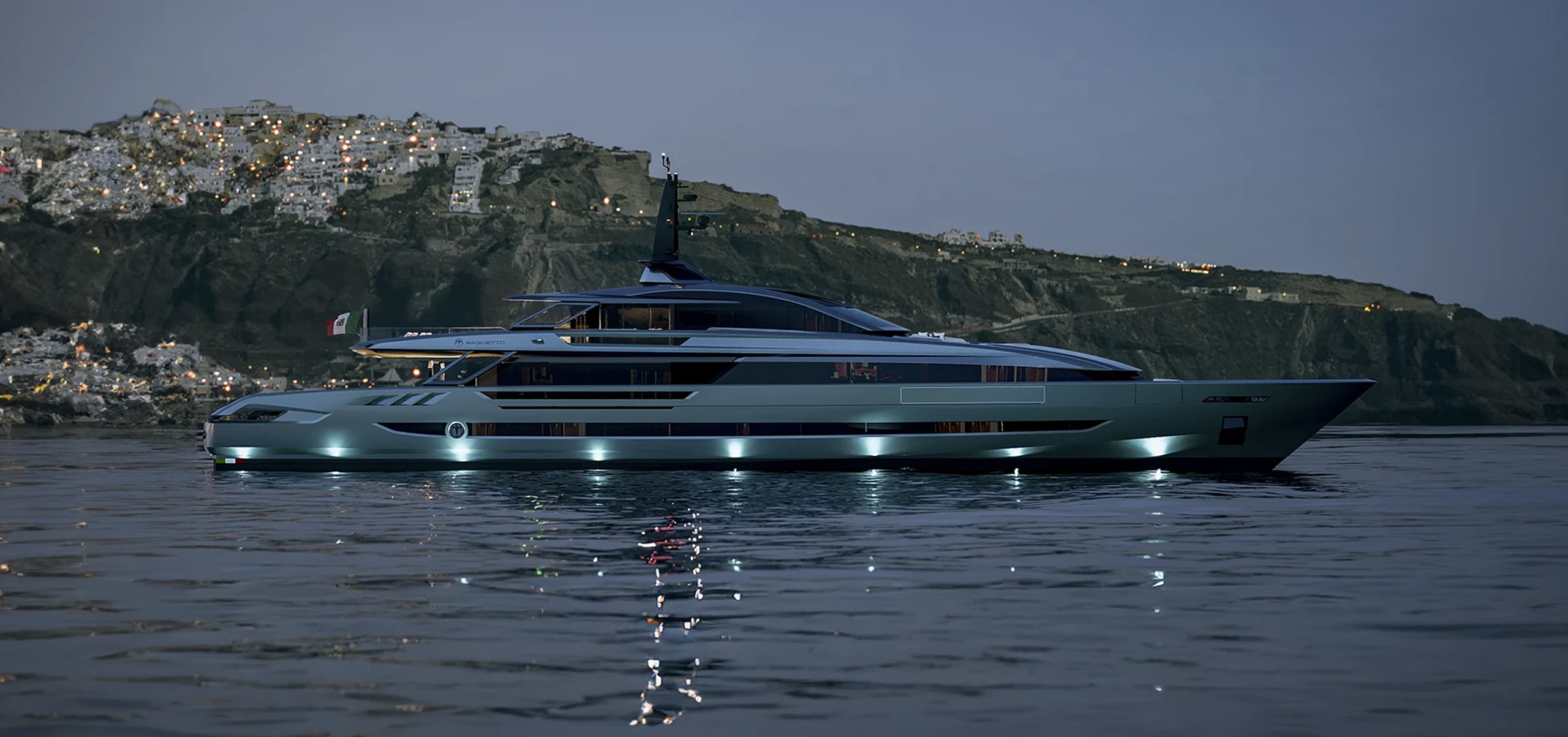 A rendering of the FAST50 lying off a lit hillside town at dusk, a low grey hull with underwater lights and BAGLIETTO on the side