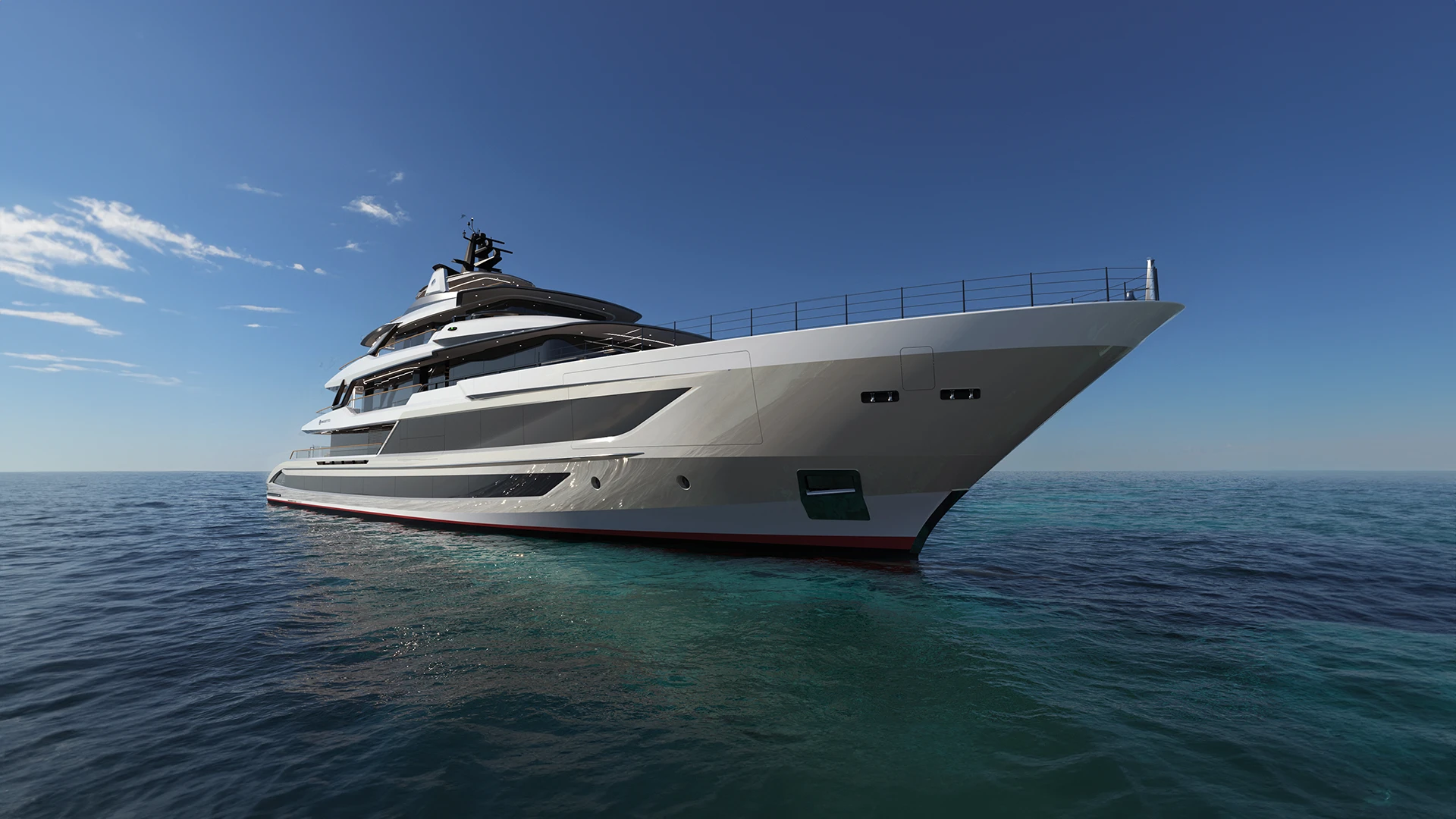 The T60 from ahead and to starboard in shallow turquoise water, showing the flared bow and the glazing along the hull side