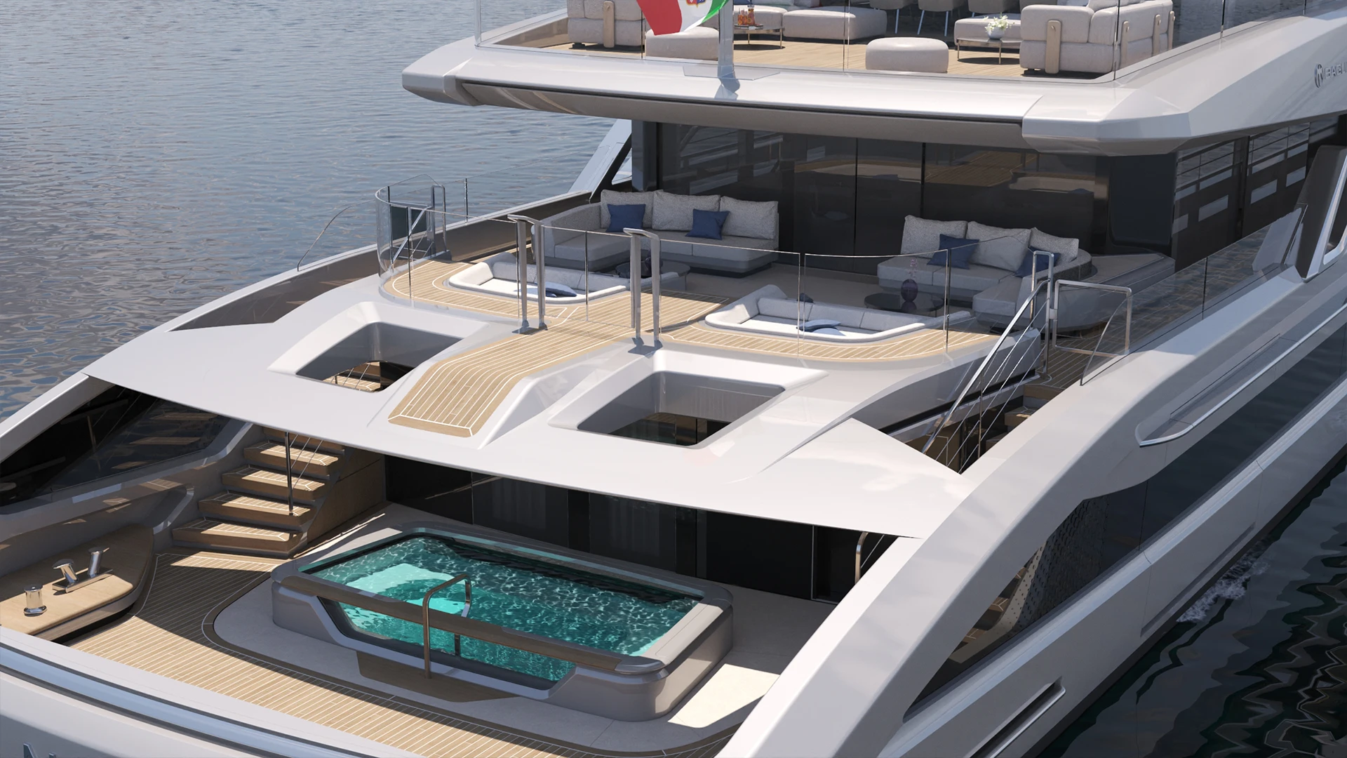 The T60's terraced aft decks seen from above, with seating on two levels and a spa pool set into the lowest deck