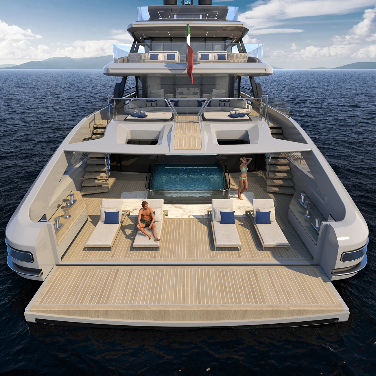 The beach area at the stern, with sun loungers on teak either side of a pool and the platform folded down to the water