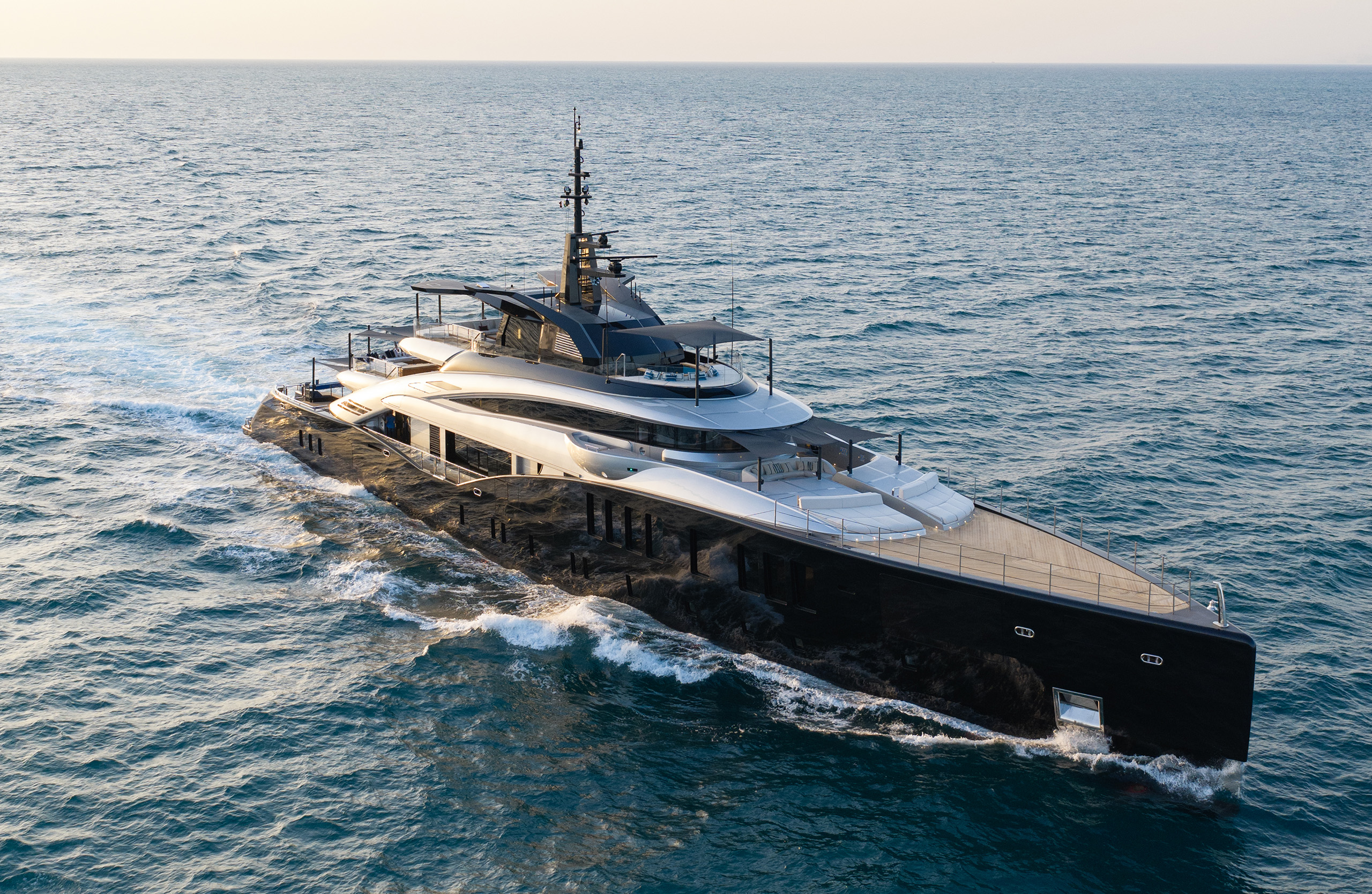 An aerial photograph of Sea Raider X from the bow quarter, the structural frame from wheelhouse roof to aft bulwark clearly visible