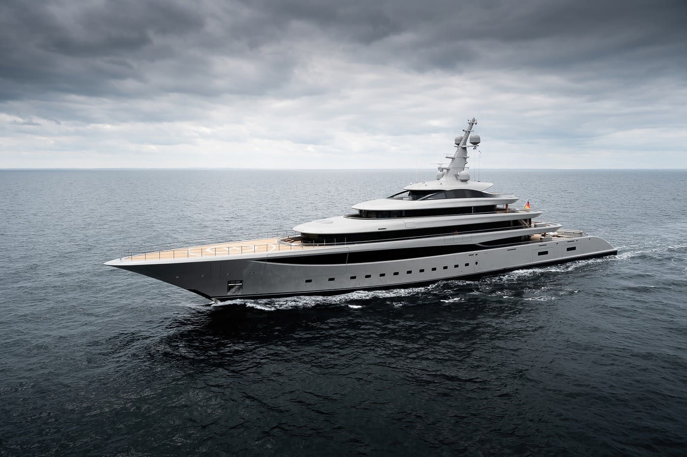 Nixie seen in full profile from ahead and to port, the helicopter circle marked out on her teak foredeck