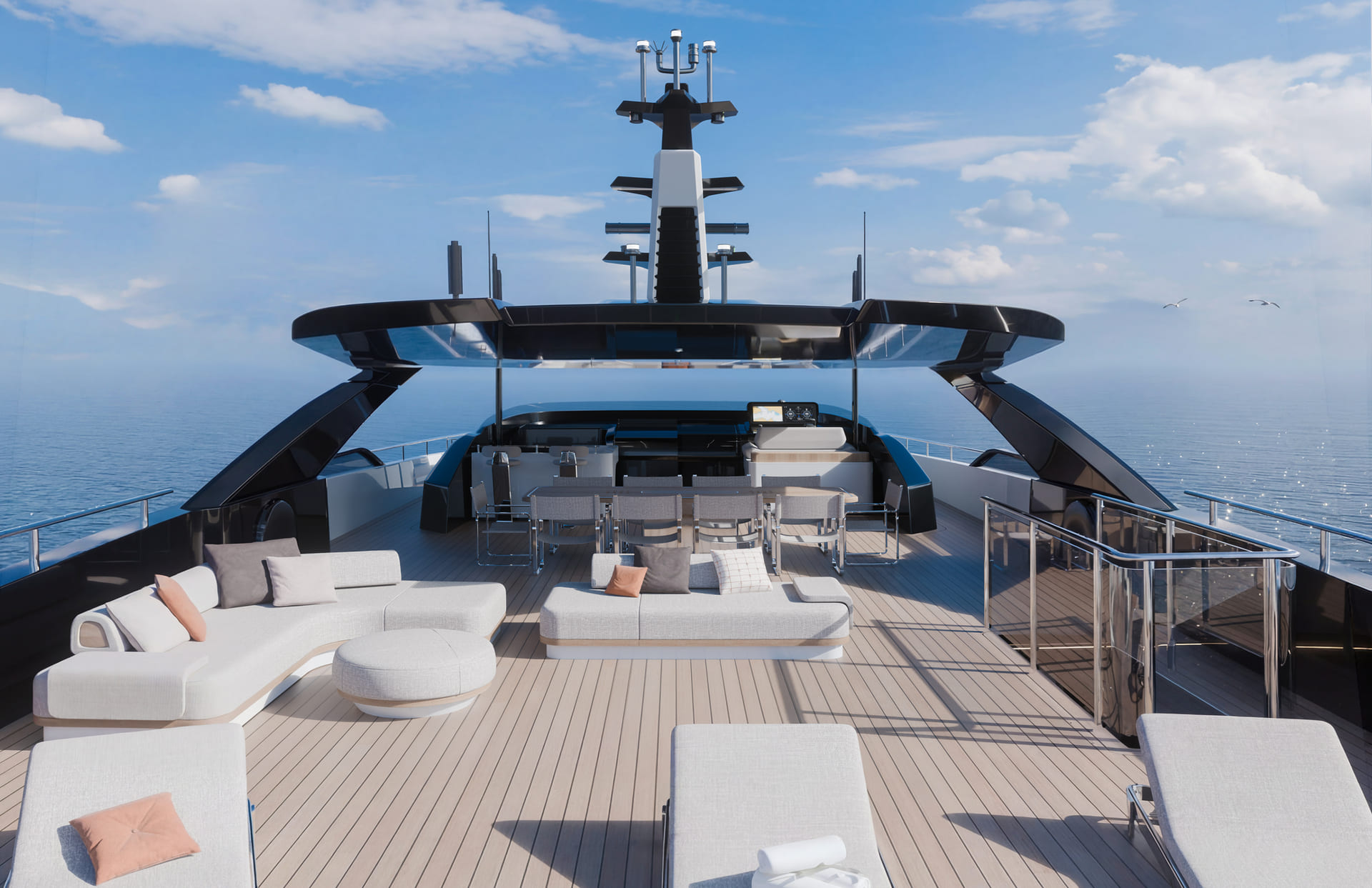 A rendering looking forward along an upper deck, sun loungers and sofas in the foreground, a dining table for eight and the mast beyond