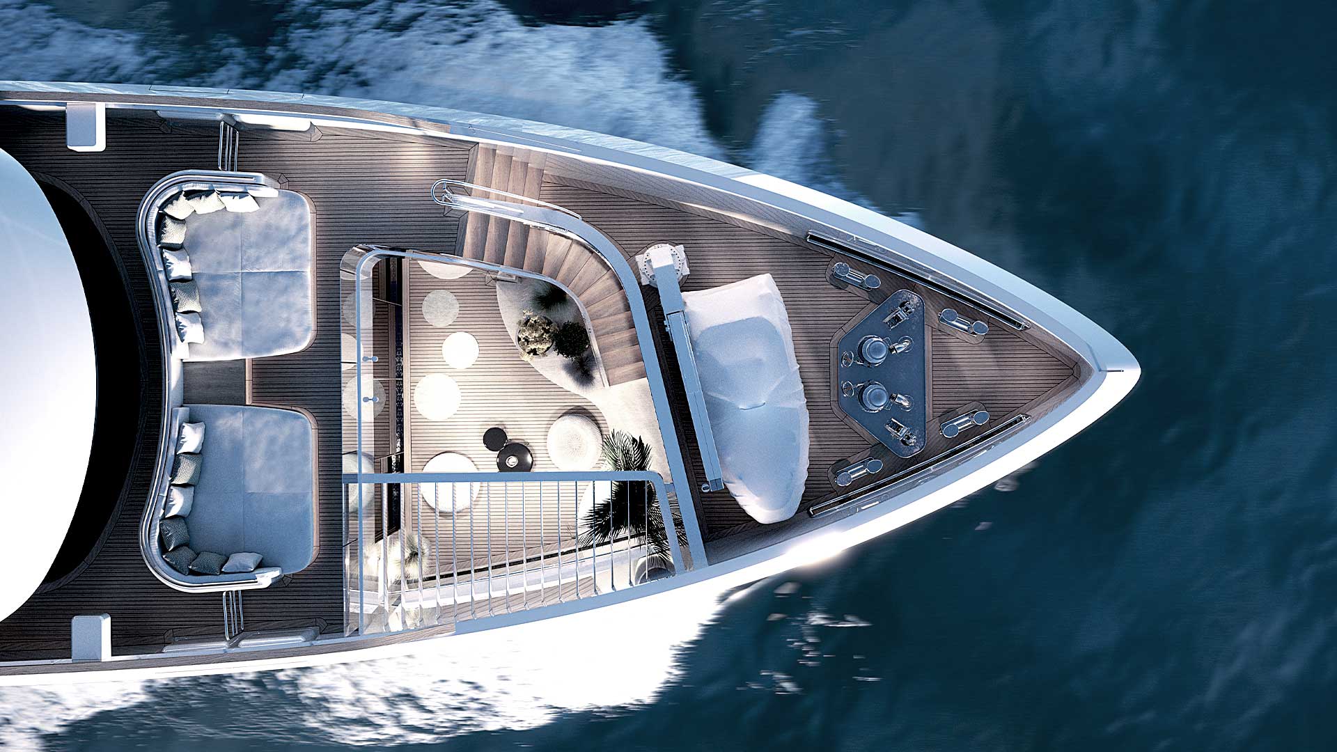 A rendering looking straight down on the foredeck, two facing sofa pods, a sunpad and a triangular table on teak
