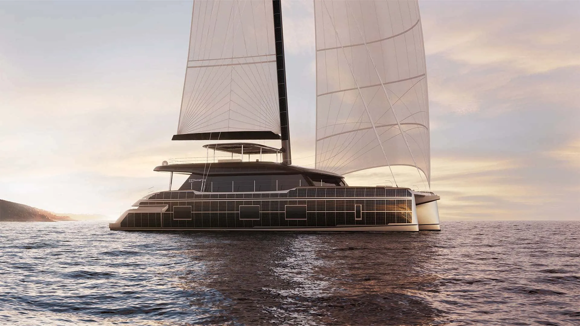 A Sunreef 100 under full sail at dusk, solar panels covering the whole side of the hull and superstructure