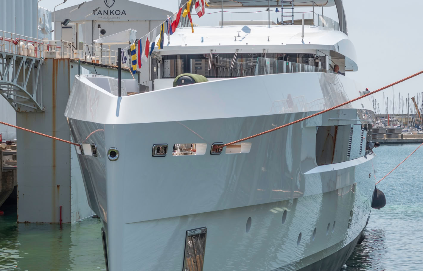 A photograph of Spirit's bow section close up, glossy white topsides and the wheelhouse glazing above